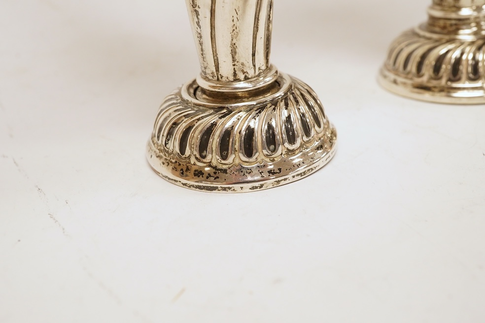 A pair of Edwardian silver spill vases, by S.W. Smith & Co, London, 1905, height 16.1cm, weighted, one split. Condition - poor